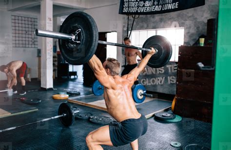 Man lifting weights at gym stock photo (126680) - YouWorkForThem