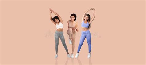 Three Diverse Women Stretching and Exercising in Vibrant Athletic Wear ...
