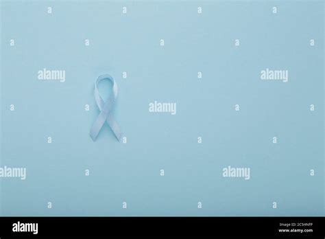 Blue ribbon symbolic for prostate cancer awareness campaign Stock Photo - Alamy