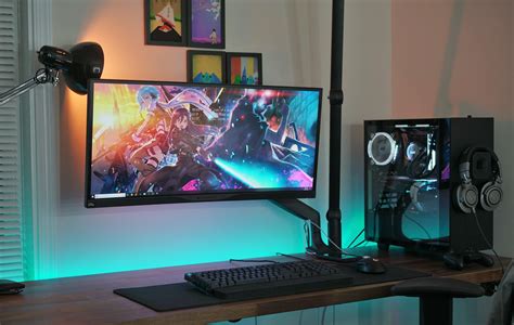 A single, ultrawide monitor setup built into a NZXT S340. That lamp ...