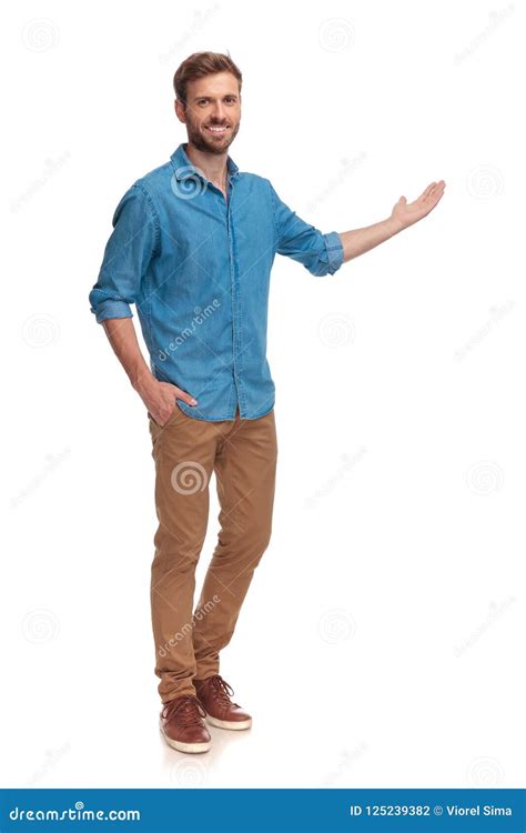 Full Body Picture of a Young Casual Man Presenting Stock Photo - Image ...
