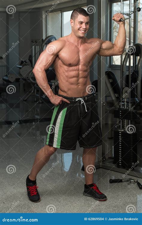 Exercise for Biceps with Cable Stock Photo - Image of caucasian, people ...