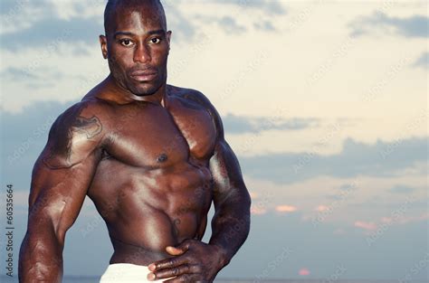 Strong man with perfect abs, shoulders,biceps, triceps and chest Stock Photo | Adobe Stock
