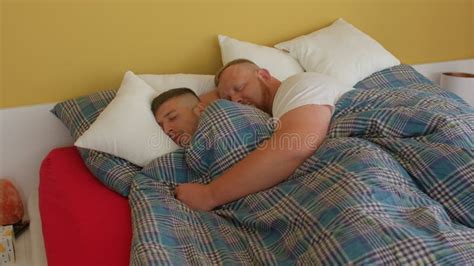 Two Guys Sleep in One Bed in Room. Recovery Time of a Person in a Dream ...