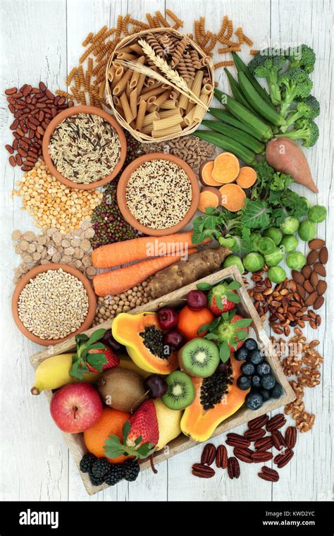 Health food for a high fibre diet with whole wheat pasta, grains, legumes, nuts, fruit ...