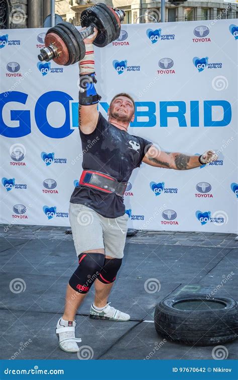 LVIV, UKRAINE - AUGUST 2015: Strong Athlete Athlete Raises Heavy Weight ...