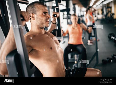 Determined athlete pushing the limits in gym Stock Photo - Alamy