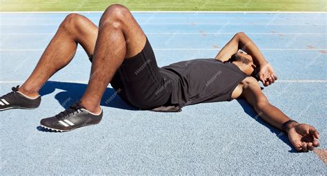 Premium Photo | Closeup of a fit active young male athlete lying ...