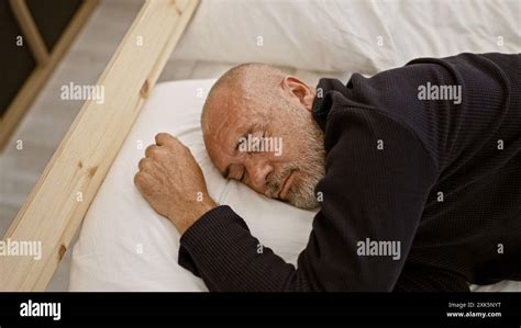 Elderly man is sleeping soundly in his bed hi-res stock photography and ...
