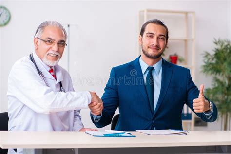 Male Doctor and Businessman Discussing Medical Project Stock Photo ...