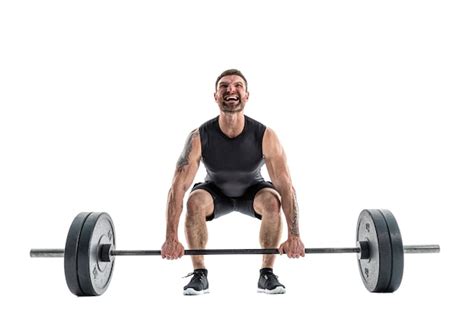 Premium Photo | Fit man doing a deadlift exercise. full length on white.
