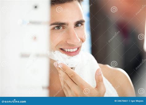 Young Man Applying Shaving Cream To His Face Stock Image - Image of ...