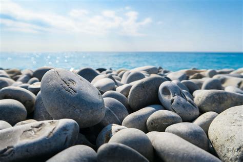 Download Smooth Rocks 1920x1080 HD Beach Desktop Wallpaper | Wallpapers.com