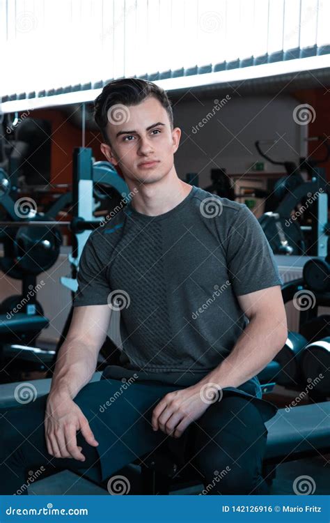 A Portrait of a Young Strength Athlete in a Gym. Stock Photo - Image of ...