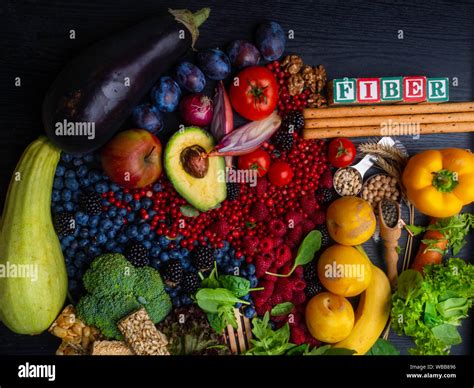 Foods rich in fiber as bread sticks, wheat, white beans, lentils, spinach, nuts, seed, pears ...