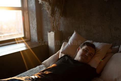 The Man is Sleeping Peacefully in the Bedroom, Relaxing. a Calm and ...