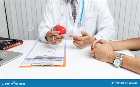 Doctor Explaining Heart To Patient. Medical and Health Care Concept ...