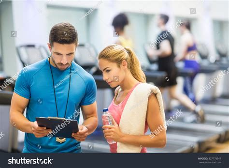 Trainer Client Discussing Her Progress Gym Stock Photo (Edit Now) 327778547