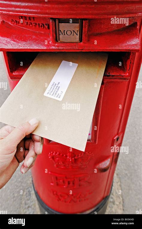 Posting a Letter Into a Post Box, UK Stock Photo: 33272665 - Alamy