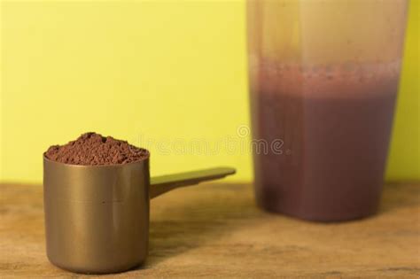 Whey Protein. Close Up of Scoop with Chocolate Powder and Shaker Stock ...