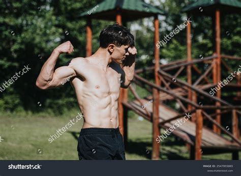 Athletic Man Flexing His Muscles Outdoor Stock Photo 2547955865 ...