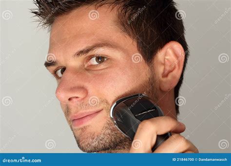 Man Shaving Face with Electric Razor Stock Photo - Image of eyes ...