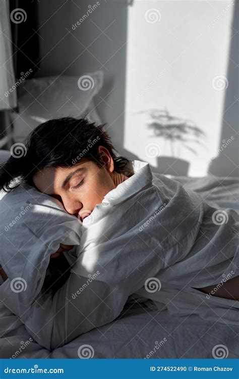 Young Black-haired Man Sleeping Deeply in the Bedroom Stock Photo ...
