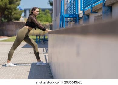 Female Athlete Stretching Legs After Exercising Stock Photo 2086643623 | Shutterstock