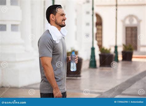 Runner Exercising and Taking a Water Break Stock Photo - Image of exercising, runner: 73966298