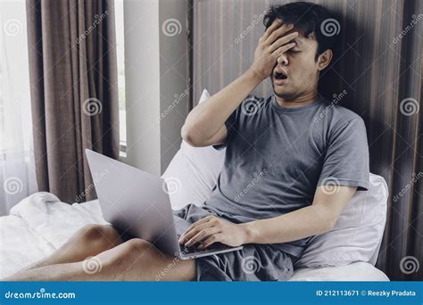 Tired Stressed Young Asian Man Feeling Sleepy and Tired while Using ...
