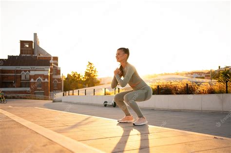 Premium Photo | Sporty woman doing jumping squats exercises on stairs in park bodyweight ...