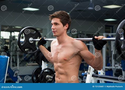 Young Smiling Athlete Lifting Weights in the Gym Stock Image - Image of ...
