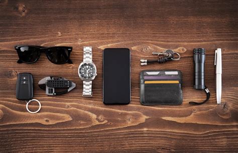 Premium Photo | Flat lay of edc or every day carry items on wooden ...