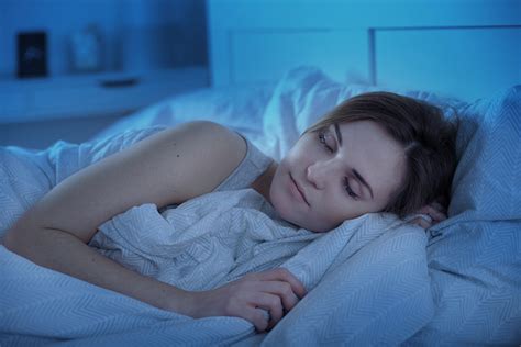 Girl peacefully sleeping in bed at night | Nurse Advisor Magazine