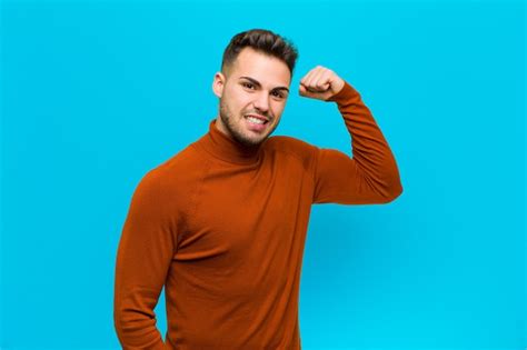 Premium Photo | Feeling happy, satisfied and powerful, flexing fit and ...