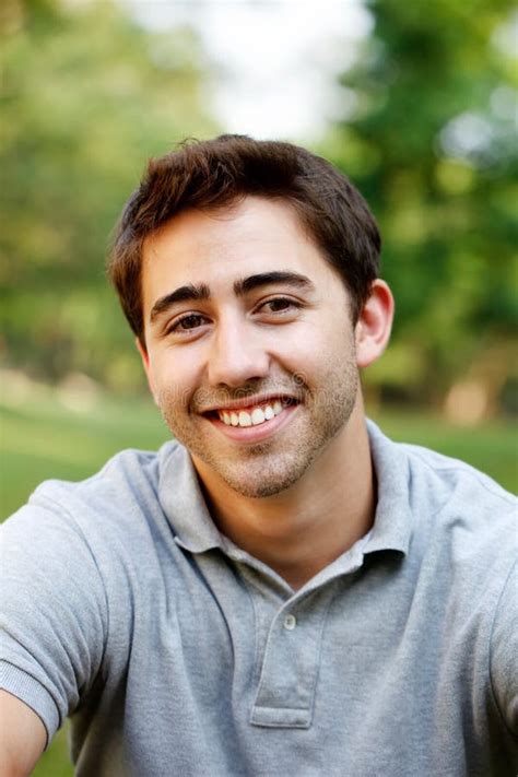 Young Man in a Red Shirt, Hat Santa Claus and Tins Stock Photo - Image ...