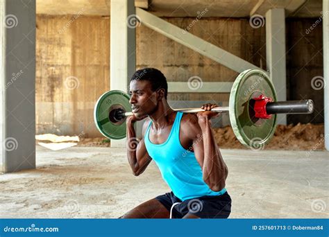 Athletic Black Young Man Lifting a Heavy-weight Barbell in Outdoor Gym ...