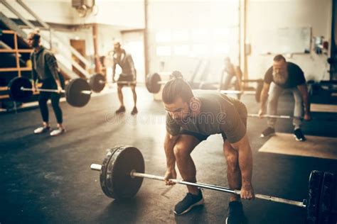 Fit Young Man Preparing To Lift Weights In A Gym Stock Image - Image of ...